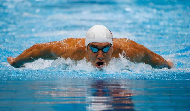 Michael Phelps of the U.S. swims during the men's 400m individual medley heats at the London 2012 Olympic Games at the Aquatics Centre